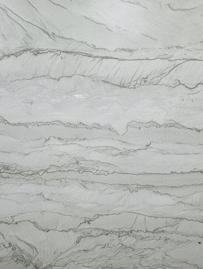 Dakar, close-up of a white and light grey slab with layered, wavy grey veining running in horizontal bands